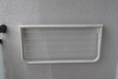 White Wall Mounted Clothes Drying Rack With Retractable Lines Fotos Stock