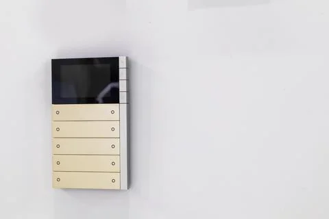 White wall mounted light switch panel Stock Photos