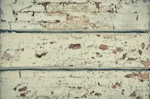 White wall of old plaster cracks are visible bricks grunge Stock-Fotos