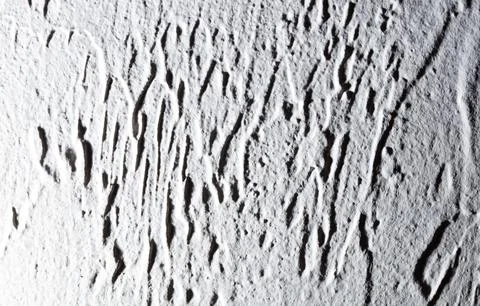 A white wall with a pattern of lines and dots Stock Photos