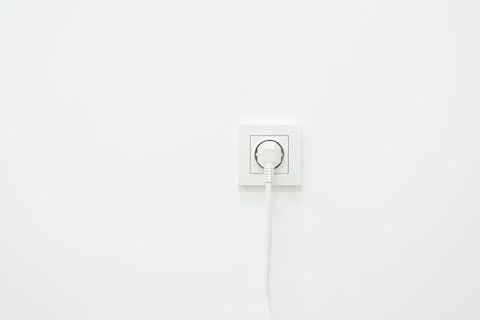 White wall with plug in it Stock Photos