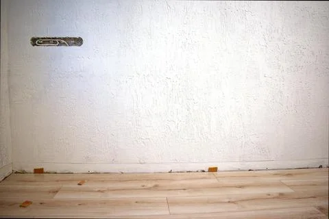 White wall with prepared socket for sockets. Repair process. Stock Photos