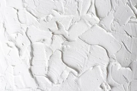 White wall putty texture, rough grunge background in close-up Stock Photos