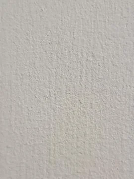 White wall texture background, rough plaster cement paint surface Foto stock