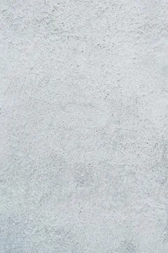 White wall texture, concrete plaster, fine grungy background. Stock Photos