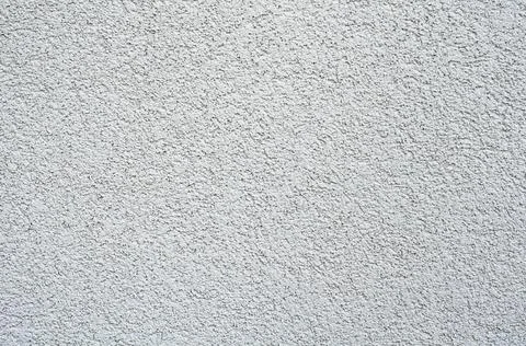White wall texture, concrete plaster, fine grungy background. Stock Photos