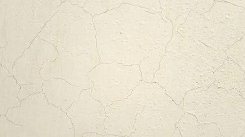 Off white wall texture with paint cracks rotating and zooming in, paper texture Stock Footage 279434598