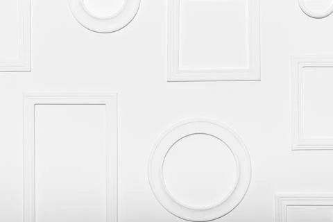 White wall with various empty frames ready for artwork display at an art Stock Photos