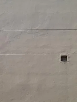White wall with a ventilation hold as background Stock Photos