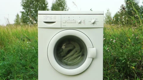 White washer machine on nature background Vídeo Stock 143883135