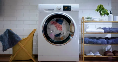 White washing machine washes clothes. 스톡 동영상 155491107