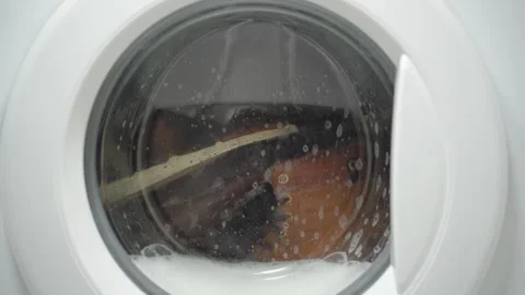 White washing machine washes dirty shoes. Stock Footage 332130568