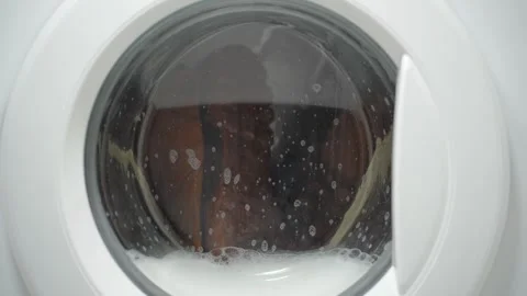 White washing machine washes dirty shoes. Stock Footage 332130581