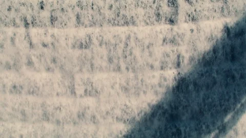 White water rushing down New Croton Dam stepped spillway with hard shadow 動画素材 242784954