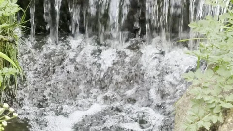 White water splashing down rocks slow motion Vídeos de archivo 335541937