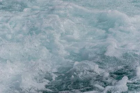 White wave foam of a strong current mountain river close-up shot (background  Stock Photos