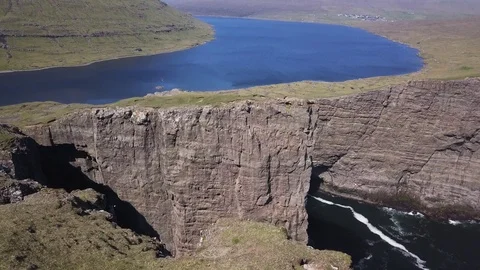 White waves breaking on the shore. Wave and stone Stock Footage 122310312