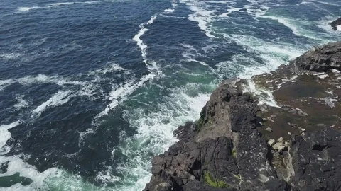 White waves breaking on the shore. Wave and stone Stock Footage 122310376