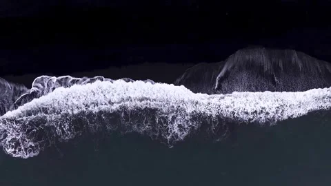 White waves crashing on a black sand beach in Iceland Stock-Footage 341328508