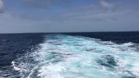 White waves in the tropical ocean generated by Cruise ship Video stock 121863457
