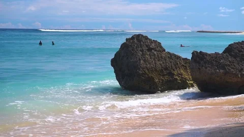 White waves washing over rock on a beach Stock Footage 81216368