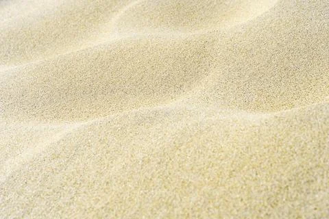 White wavy sand background. Macro shot with blur. Copy space. Stock Photos