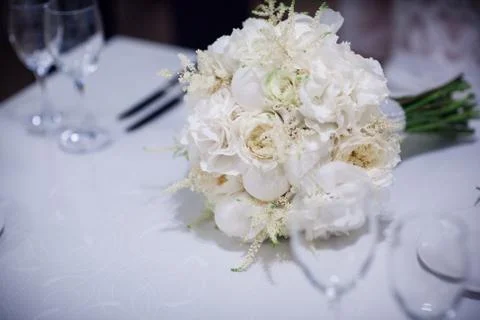 White wedding bouquet on table Stock Photos