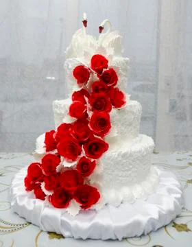White wedding cake with swans Stock Photos