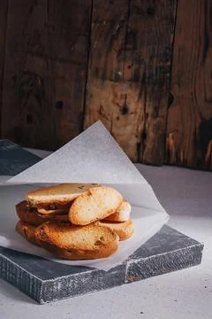 White wheat bread crackers, sweet croutons with raisins on paper Stock Photos