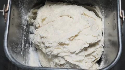 White wheat flour dough is substituted in metal form of dough preparation machin Stock-Footage 247498869