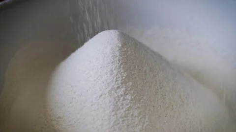 White Wheat Flour Falling Into a Heap During Baking Preparation Video stock 339064799