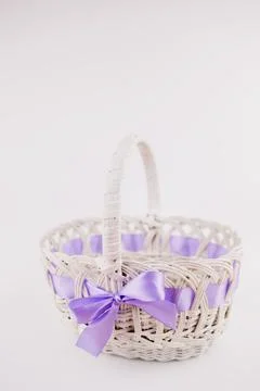 White wicker basket for easter on white background Stock Photos