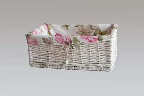 White wicker basket of rectangular shape isolated on gray background. Stock Photos