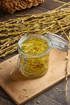 White willow bark collected in spring, macerating in alcohol to prepare herba Stock Photos