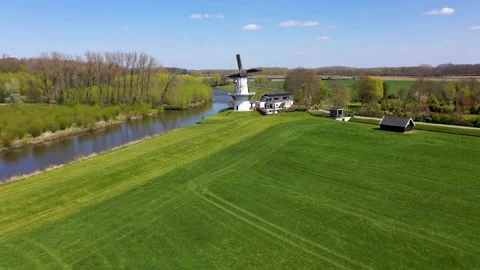 White windmill with blossom Video stock 154659257
