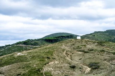 White windmill on distant Montejunto hill Foto stock