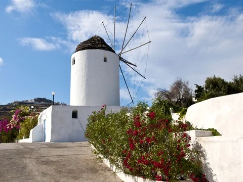 White windmill house in town in valley of Fira in Santorina Greece in Greek 動画素材 75687928