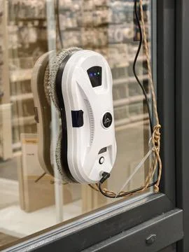 White window cleaning robot is a Cleanbot model Stock Photos