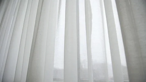 White window curtain blown by the wind shot against outdoor light Video stock 102493538
