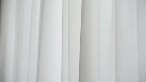 White window curtain blown by the wind shot against outdoor light 스톡 동영상 102493612