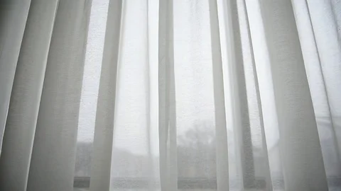 White window curtain blown by the wind shot against outdoor light Video stock 102493634