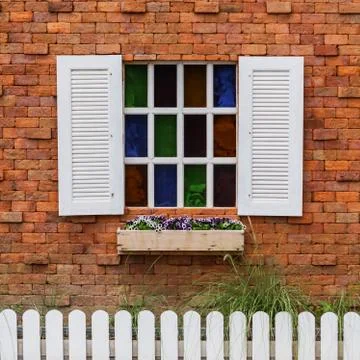 White window on the red brick wall Stock Photos
