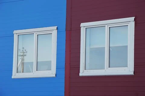 White windows in modern plastic frames on the facade of an industrial office Fotos Stock