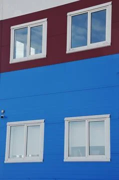 White windows in modern plastic frames on the facade of an industrial office 写真素材