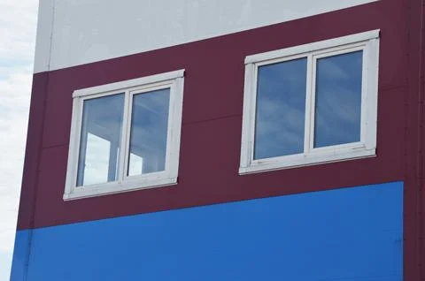 White windows in modern plastic frames on the facade of an industrial offic.. 写真素材