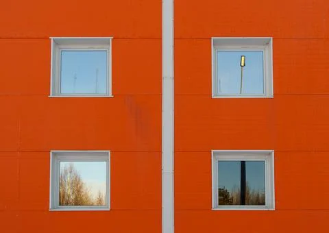 White windows on orange wall background Фото
