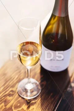 White wine in glass with bottle Stock Photos