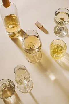 White wine served in assorted crystal glasses Stock-Fotos