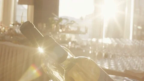 White wine on table with different food snacks and appetizers in the sun on Stock Footage 105105121