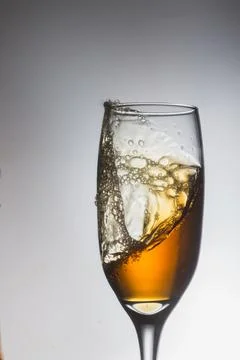 White wine on the white background Stock Photos